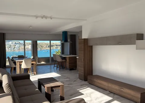 The living room, with the sea view through the windows